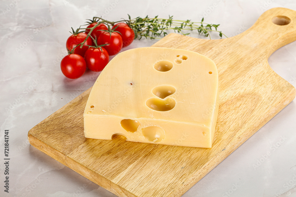Maasdam cheese brick over board Maasdam cheese brick over board