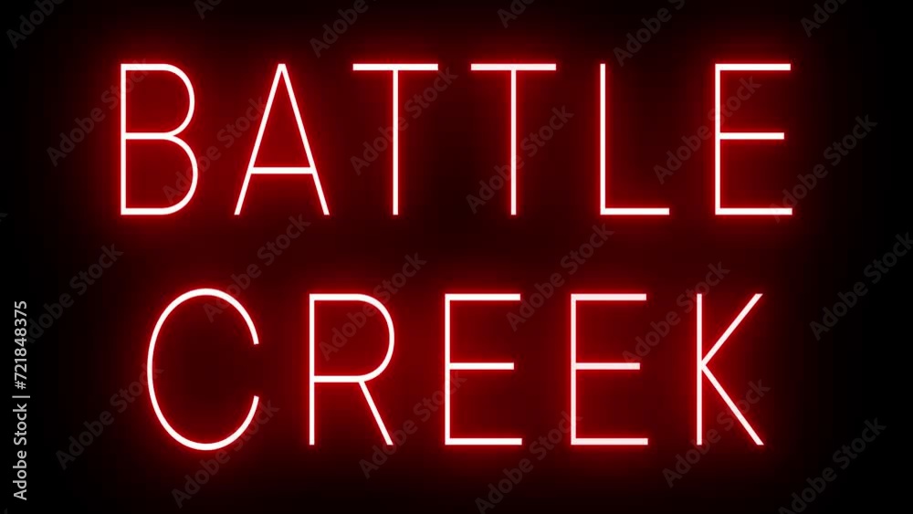 Flickering red retro style neon sign glowing against a black background for BATTLE CREEK