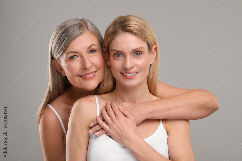 Beautiful women with healthy skin on gray background Beautiful women with healthy skin on gray background