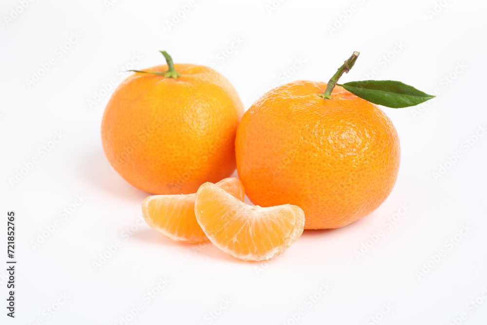 Fresh ripe tangerines with leaf isolated on white. Citrus fruit Fresh ripe tangerines with leaf isolated on white. Citrus fruit