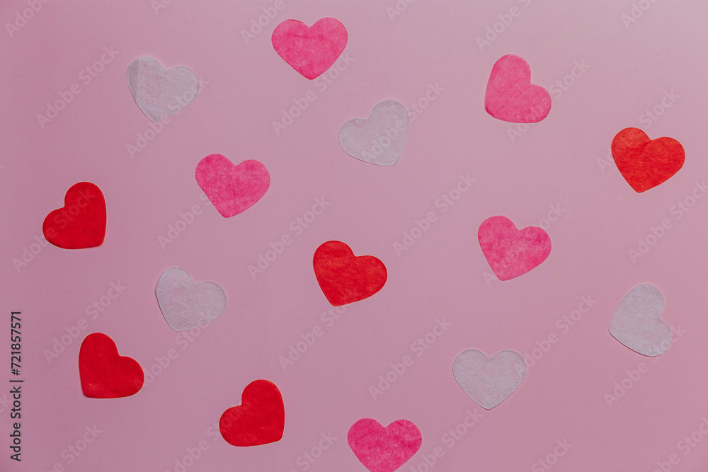 hearts on pink colored background, minimal trend seamless pattern, color print as valentines day or wedding background. Paper cut hearts, romantic holiday concept, top view