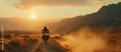 Motorcyclist on a desert trail at sunset, the dust and sun crafting a golden adventure © Ai Studio