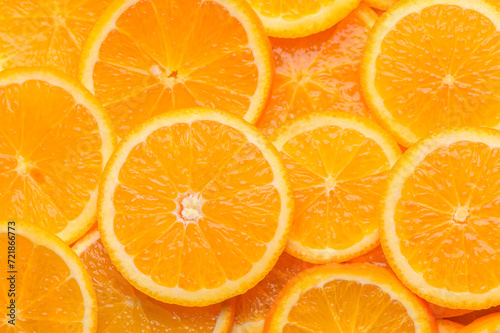 oranges cut into slices and laid out on the table as a food background 7