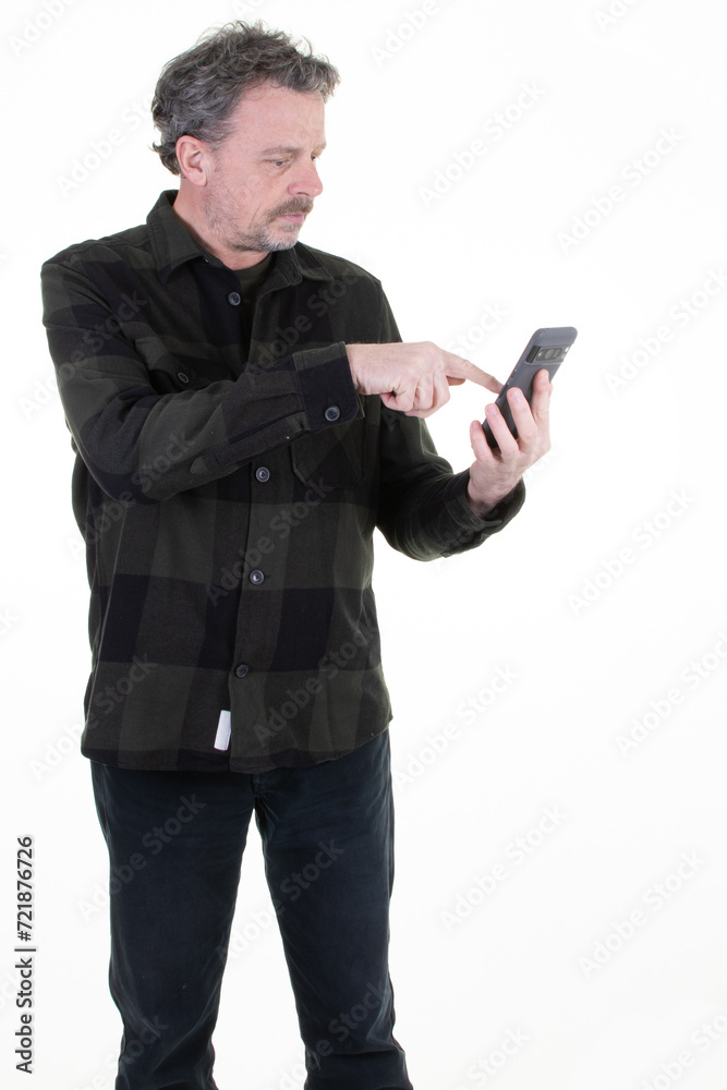 handsome middle aged man texting cell smartphone on mobile phone and standing front white background handsome middle aged man texting cell smartphone on mobile phone and standing front white background