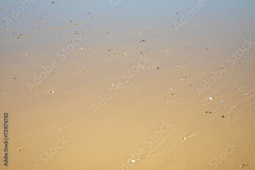 sand texture sea beach background with stones on sandy pattern wallpaper