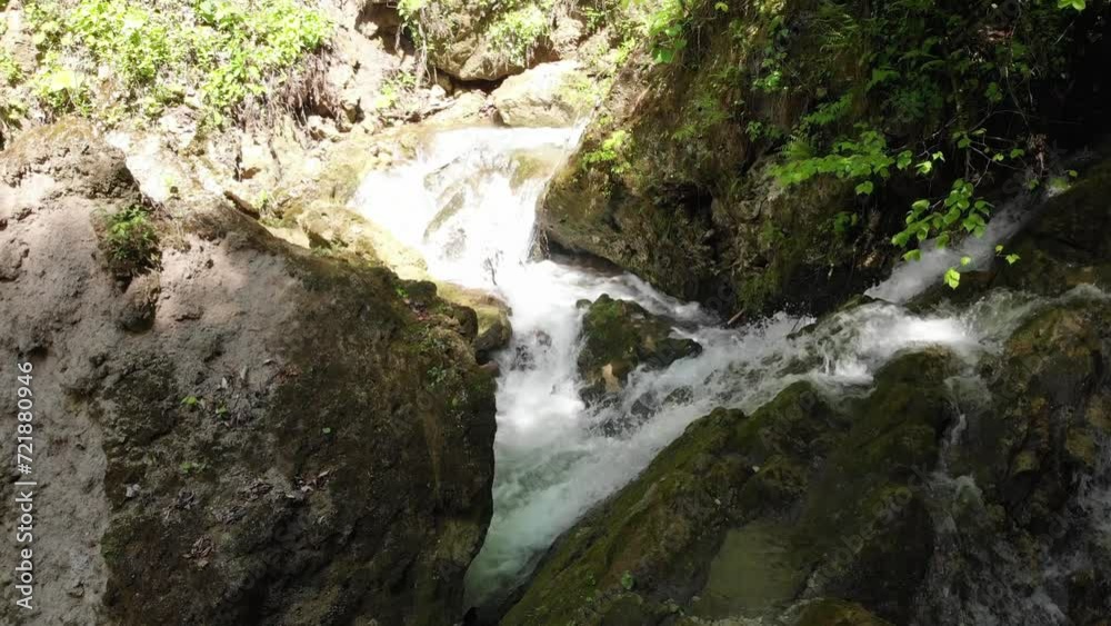 Caucasus. North Ossetia. Kurtat gorge. Stream on stones in the forest. Caucasus. North Ossetia. Kurtat gorge. Stream on stones in the forest.