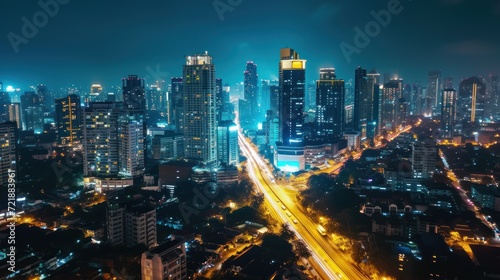 Stunning City View of Futuristic Skyline at Night, Skyscrapers with flashing lights and Car Traffic Flow on Main road, Aerial Hyperlapse Time Lapse, Drone View