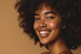 Beautiful portrait of African American woman with clean healthy skin and curly black hair.