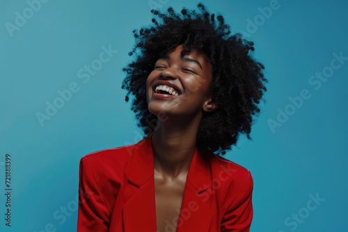 Smiling African American woman sending message on blue background