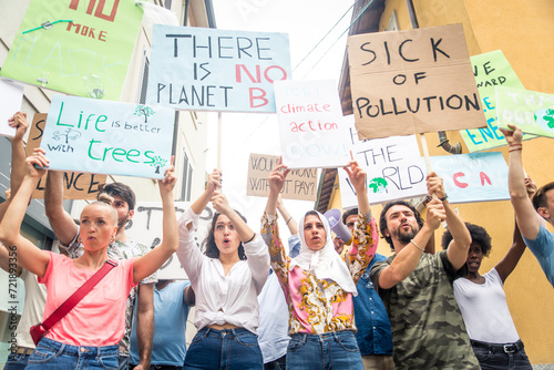 Public demonstration on the street against global warming and pollution. Group of multiethnic people making protest about climate change and plastic problems in the oceans © oneinchpunch