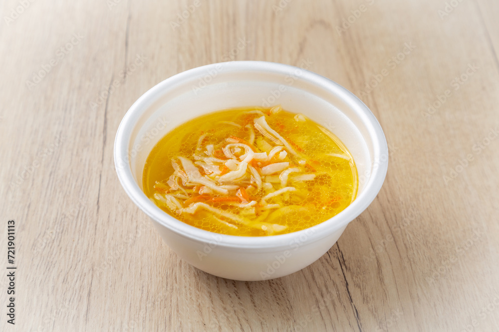 Chicken noodle soup. On a light wooden background. Chicken noodle soup. On a light wooden background.