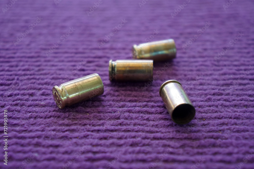 9 mm Bullet casings on the purple carpet
9 mm Bullet casings on the purple carpet