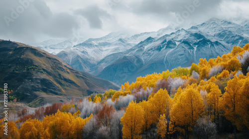 A mountain range in the autumn with yellow trees.