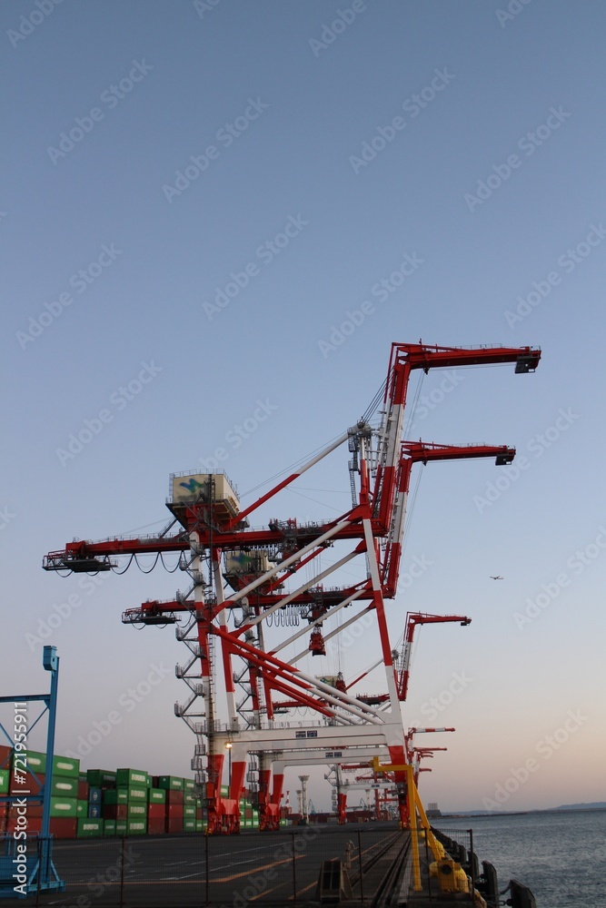 Gantry cranes in dusk at Aomi Container Terminal in Tokyo, Japan Gantry cranes in dusk at Aomi Container Terminal in Tokyo, Japan