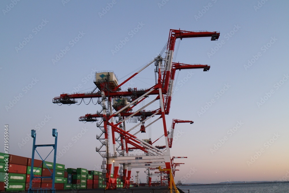 Gantry cranes in dusk at Aomi Container Terminal in Tokyo, Japan Gantry cranes in dusk at Aomi Container Terminal in Tokyo, Japan
