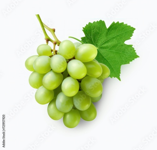 a bunch of green grapes with a leaf