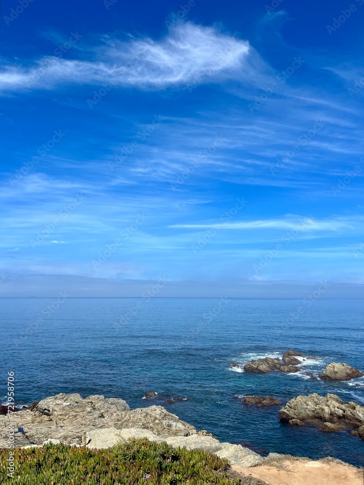 Blue ocean view, rocky coast with colorful plants, vivid ocean coast, natural colors, blue sky, summer Blue ocean view, rocky coast with colorful plants, vivid ocean coast, natural colors, blue sky, summer