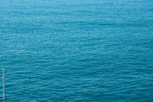 Fototapeta Naklejka Na Ścianę i Meble -  Sea surface aerial view,Bird eye view photo of blue waves and water surface texture Blue sea background Beautiful nature Amazing view sea background.