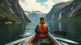 View from the back of a girl in a canoe floating on the water among the fjords 