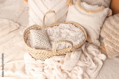 Boho style. Wicker basket made of wicker. Photophone for a newborn photo shoot. Basket with a pillow.