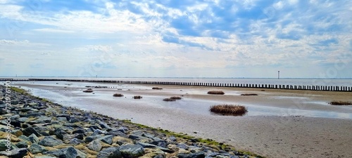 Wurster North Sea Coast - Wremen - Northern Germany - the dike and the dike foreland in the mudflats photo