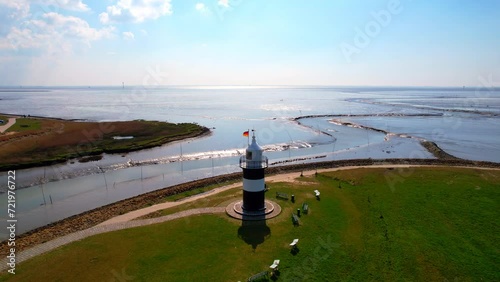 Little Preusse lighthouse - Wurster North Sea coast - Wremen - Northern Germany - rising aerial view with fantastic views of the Weser estuary in the Wadden Sea photo