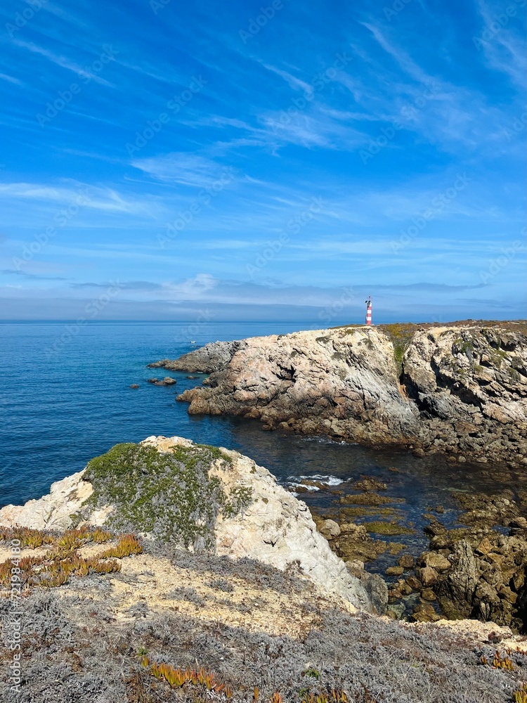 Rocky ocean coast, blue ocean horizon