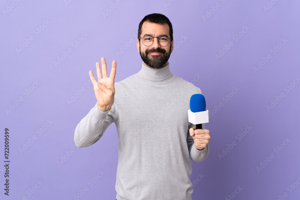 Adult reporter man with beard holding a microphone over isolated purple background happy and counting four with fingers Adult reporter man with beard holding a microphone over isolated purple background happy and counting four with fingers