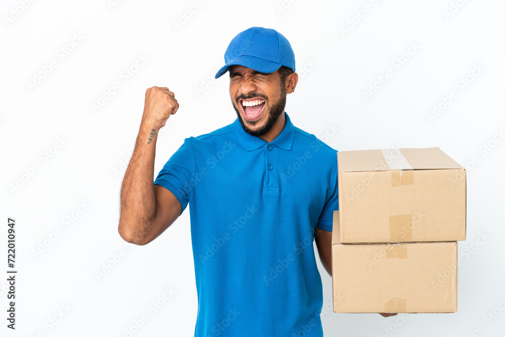 Delivery Ecuadorian man isolated on white background celebrating a victory Delivery Ecuadorian man isolated on white background celebrating a victory