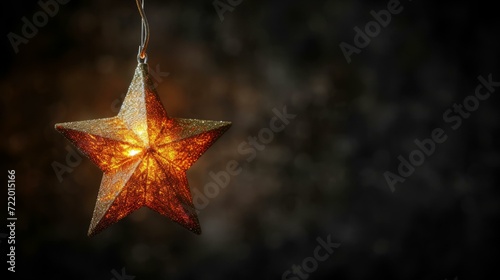 Glowing Christmas star hanging on dark background