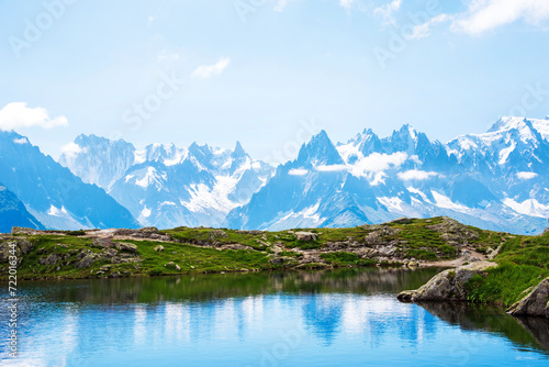 Fantastic landscape with reflection of mountains in the lake on the background of Mont Blanc, French Alps. (Harmony, tourism, meditation - concept)
