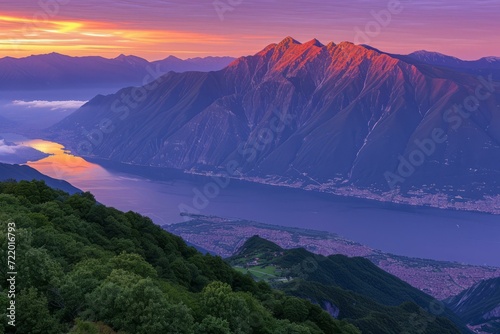 Scenic view of mountains and lake at sunset
