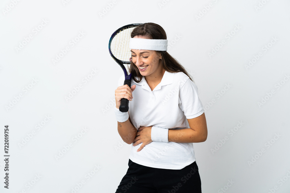 Young woman tennis player over isolated white background smiling a lot Young woman tennis player over isolated white background smiling a lot