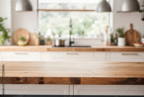 Selective focus on wooden kitchen island. Empty wooden table with copy space for display products. Clean countertop for cooking. © Elena