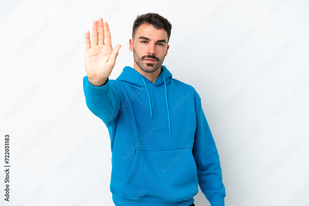Young caucasian man isolated on white background making stop gesture Young caucasian man isolated on white background making stop gesture