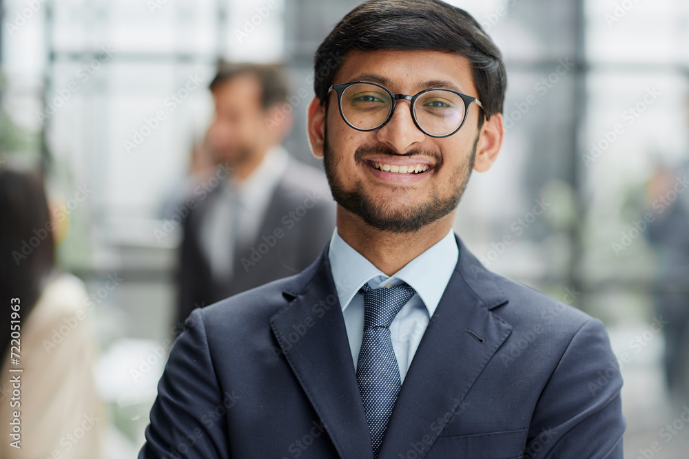 Fototapeta premium Handsome young business man standing confident in the office
