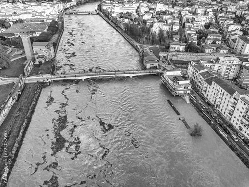 Aerial view of the Arno river during flood, Pisa, Italy