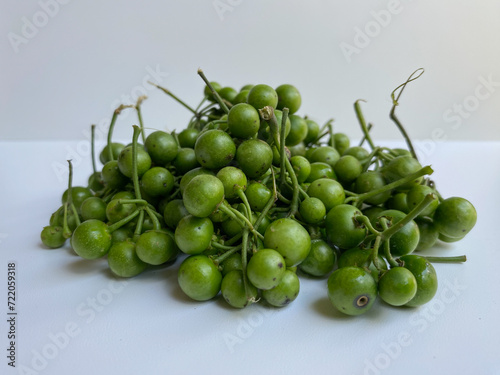 Fruit of Solanum nigrum, the European black nightshade or leunca, isolated on white background photo