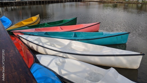  Colorful canoes floating on the dock