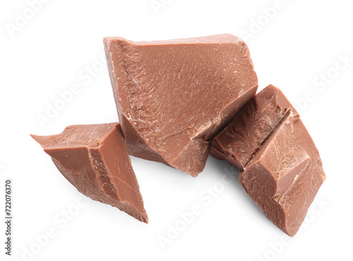 Pieces of tasty milk chocolate isolated on white, top view
