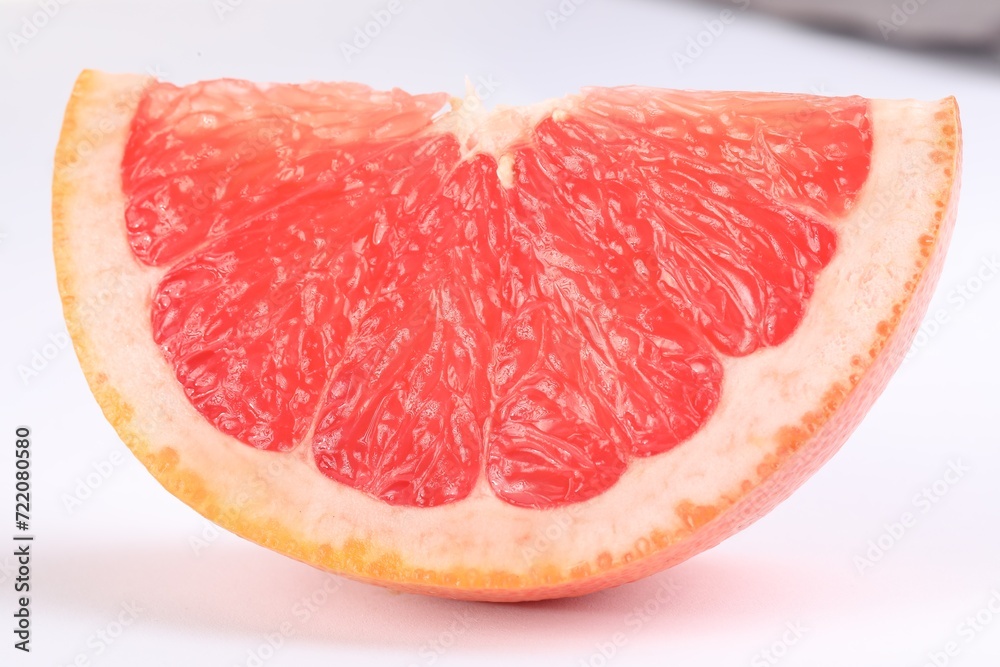 Cut ripe grapefruit isolated on white. Citrus fruit