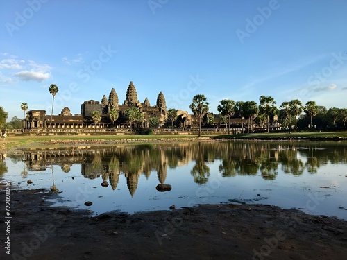 Reflection of Angkor Temple in a serene pond. Cambodia © Wirestock
