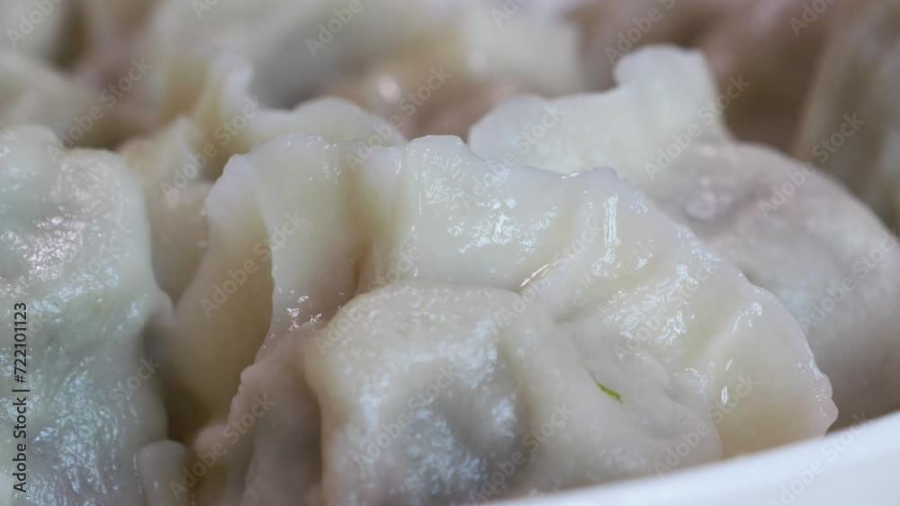 Plate of freshly cooked chinese dumplings,Chinese dumpling is one of the most important foods in Chinese New Year and other Chinese holidays or festivals.it is part of the Chinese culture or tradition Plate of freshly cooked chinese dumplings,Chinese dumpling is one of the most important foods in Chinese New Year and other Chinese holidays or festivals.it is part of the Chinese culture or tradition
