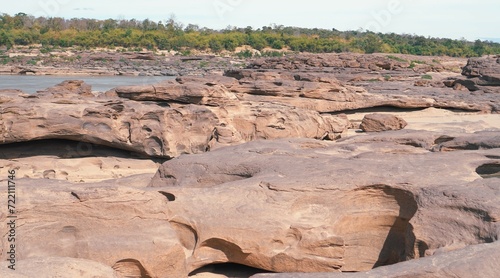 sam phan bok, ubon ratchathani,Rocks have holes that have been eroded by water until they have beautiful holes. photo