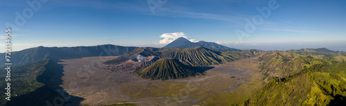 Panoramic view of a volcanic landscape under a clear blue sky