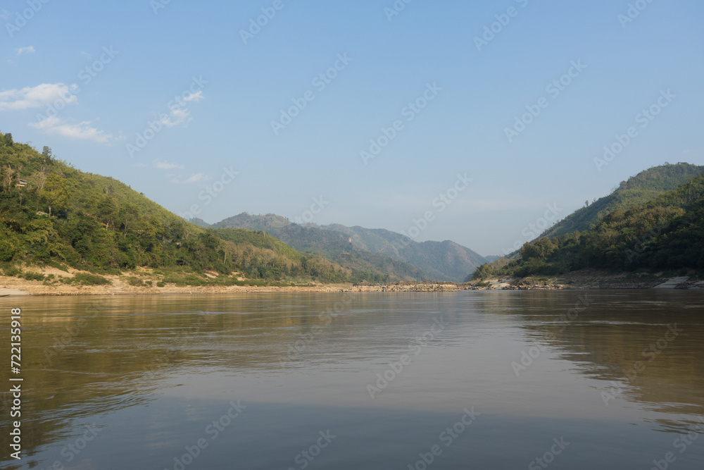 Calm river flowing through a serene mountainous landscape