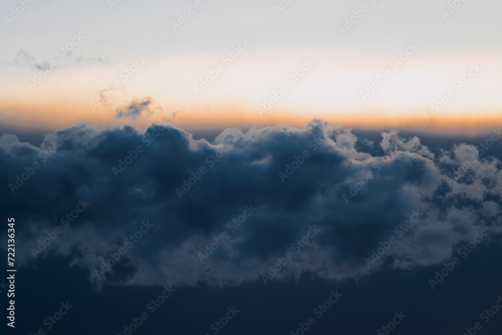 Beautiful blue and orange sky with clouds at twilight