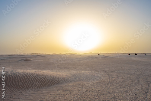 Beautiful sunset over Sahara desert in Douz, Tunisia. Sand and dunes against sky