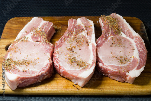 Wallpaper Mural steaks with seasoning on a wooden board Torontodigital.ca