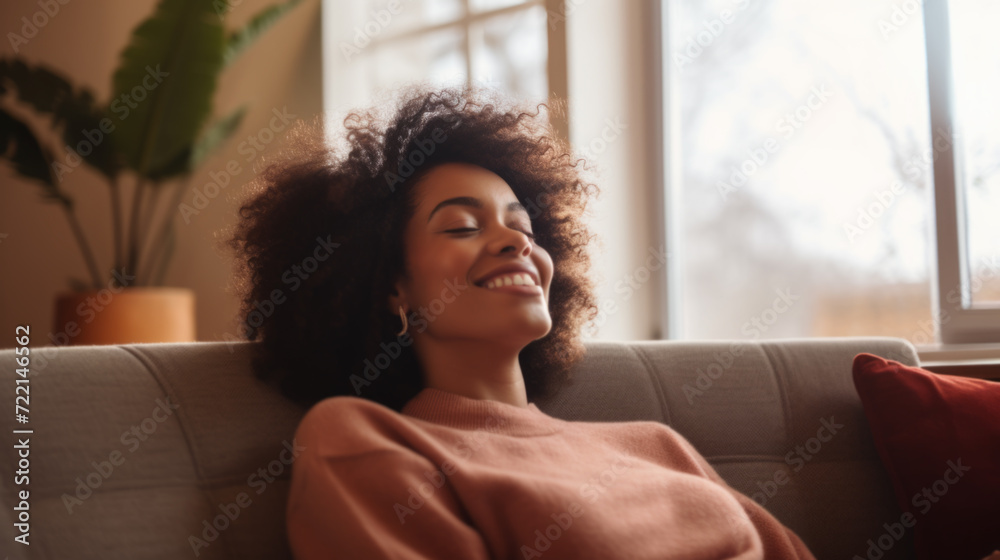 Happy afro american woman relaxing on the sofa at home Happy afro american woman relaxing on the sofa at home